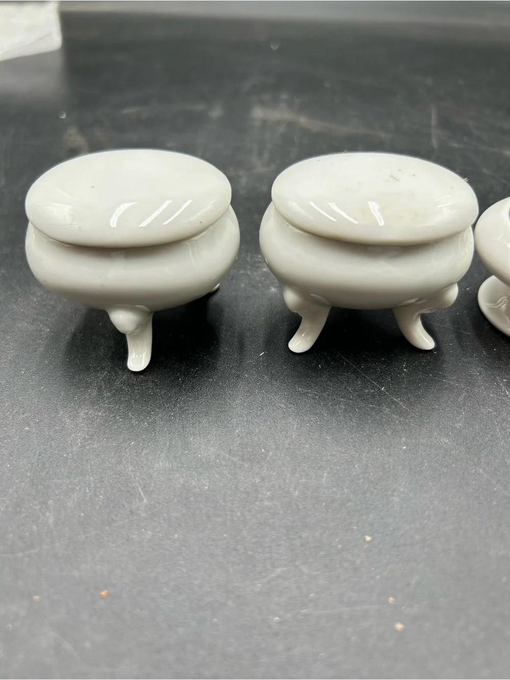 Set of 3 Small White Porcelain Footed Trinket Boxes and A Small White Basket